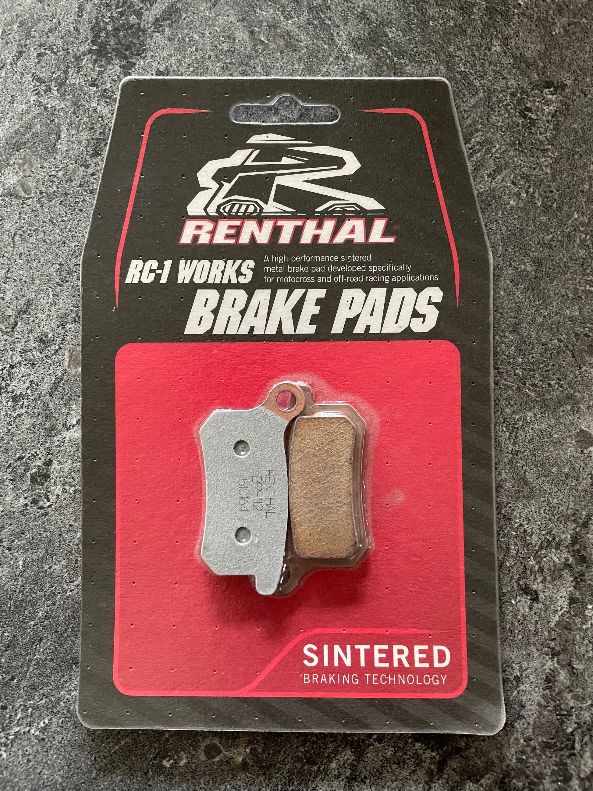 Renthal RC-1 Works BP-112 brake pads on a gray background